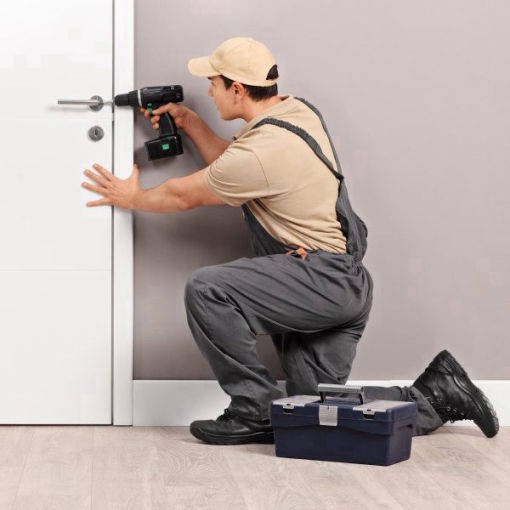 locksmith technician drilling house door locks